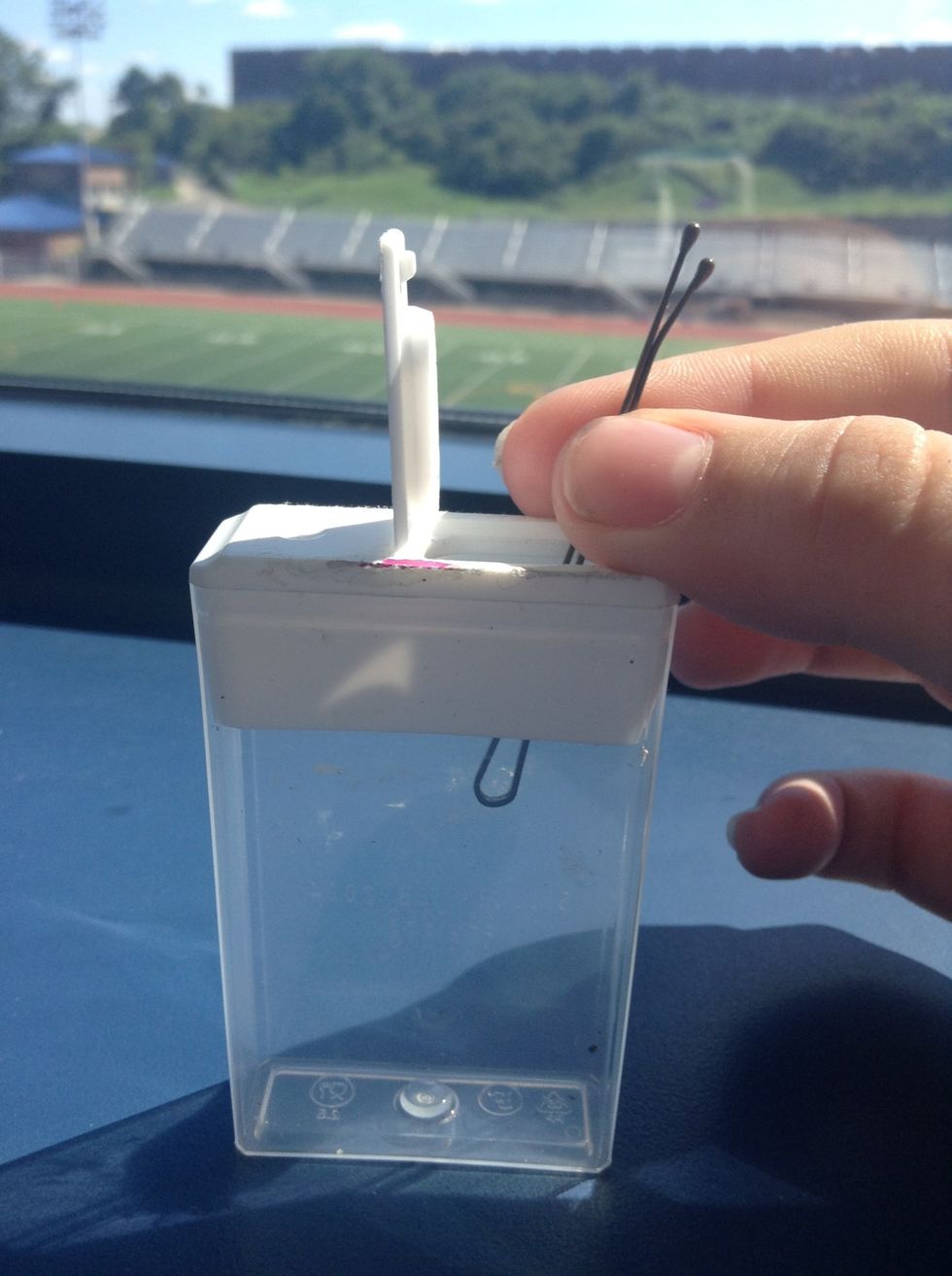 Place bobby pins inside the container.