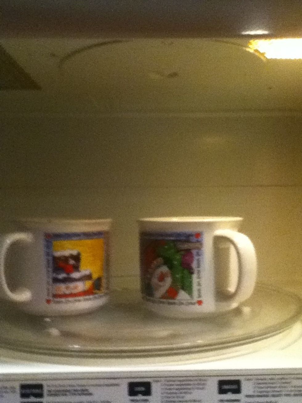 place both cups in the microwave for 2 minutes make sure to watch because they will rise above the rim