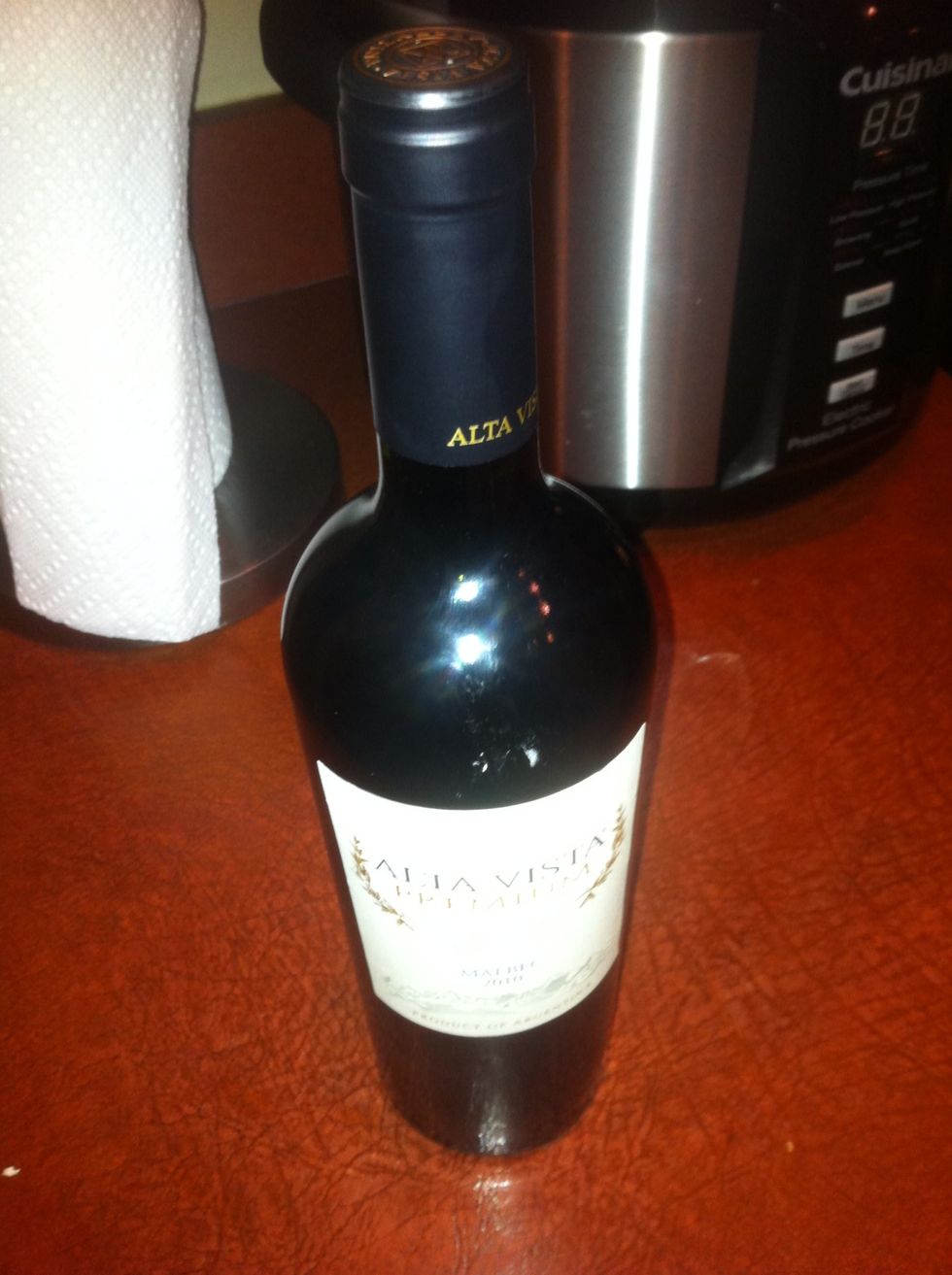 Place bottle (preferably a Malbec) onto a level surface near a drawer where a corkscrew is kept.