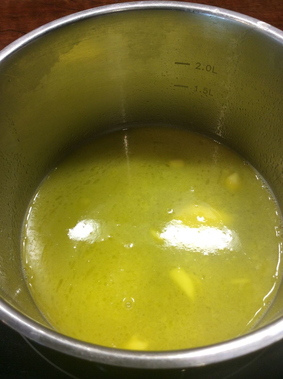 Place butter and cold water into a saucepan and heat until butter has melted.