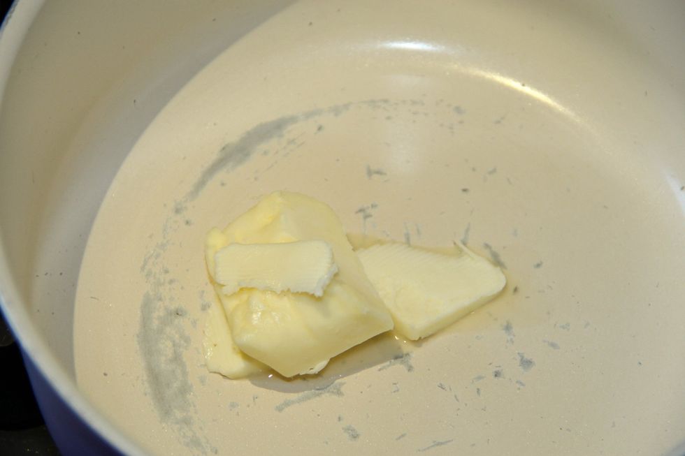 Place butter in pot and have it melt.