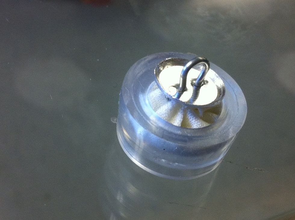 Place button back onto assembly.