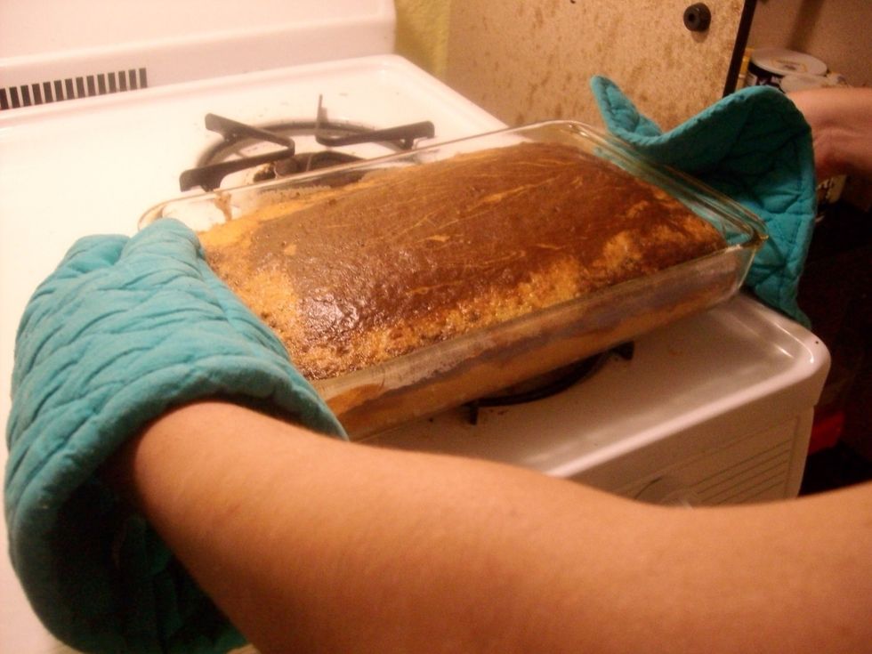 Place cake on top of the stove and let it cool for 10 minutes.