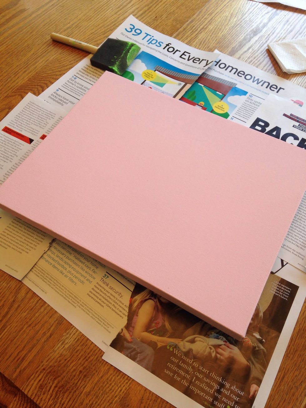Place canvas on a safe surface to paint (we use glossy magazine pages instead of newspaper which can smear ink).  Paint 2 coats (or more), allowing time for each layer of paint to dry.