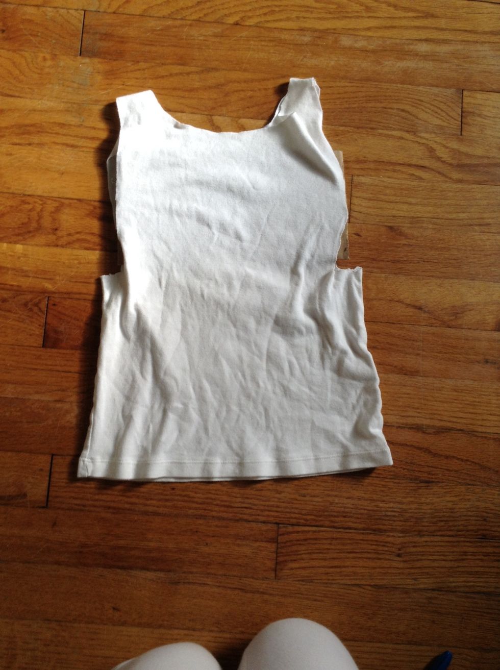 Place cardboard between the front and back of the shirt so when drawing with the fabric markers none of the colors bleed through.
