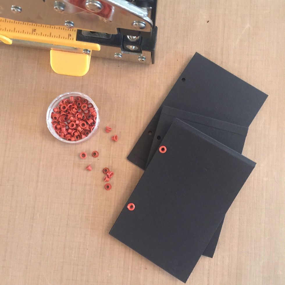 Place cassette tape over pocket page to mark where you will punch the holes. I used the two holes closest to the edge of the cassette tape (see step 10, if unsure) Use eyelets to reinforce holes.