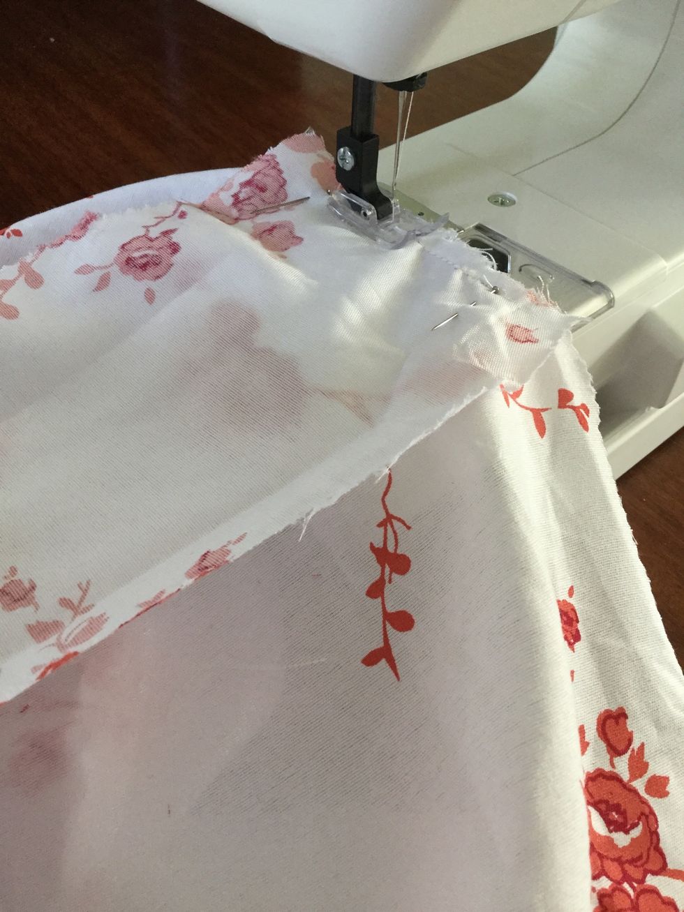 Place centre of side panel on bottom seam right sides facing. Sew together within 5cm of seam allowance for side panel.