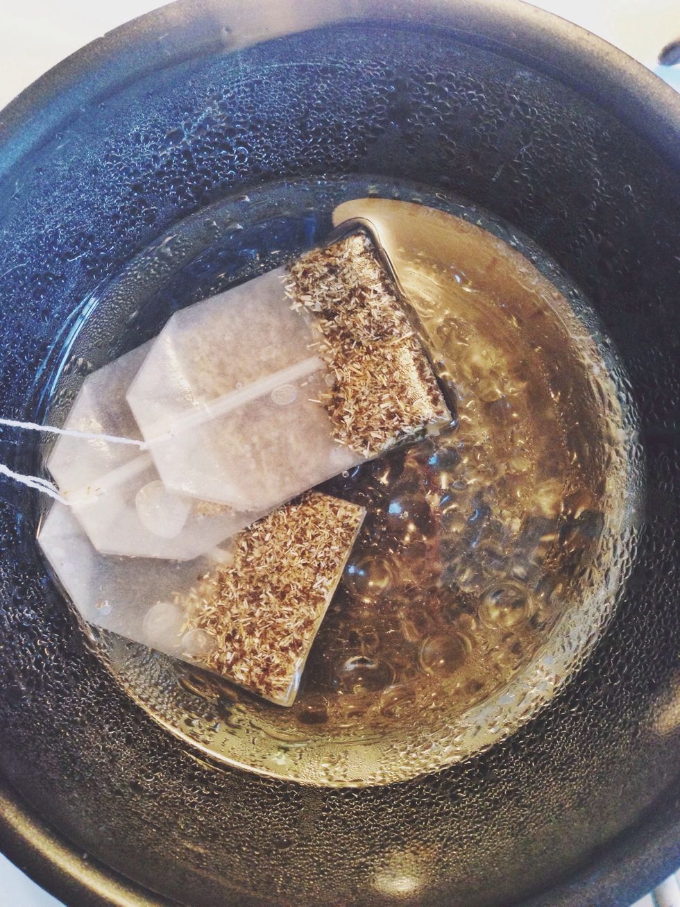 Place chamomile and calendula in coconut oil. Let sit on very low heat for at least an hour until coconut oil turns yellow and is fragrant.