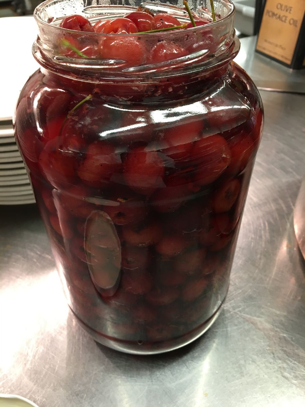 Place cherries in a large glass jar.Chill for 3 days and they are ready to eat.
