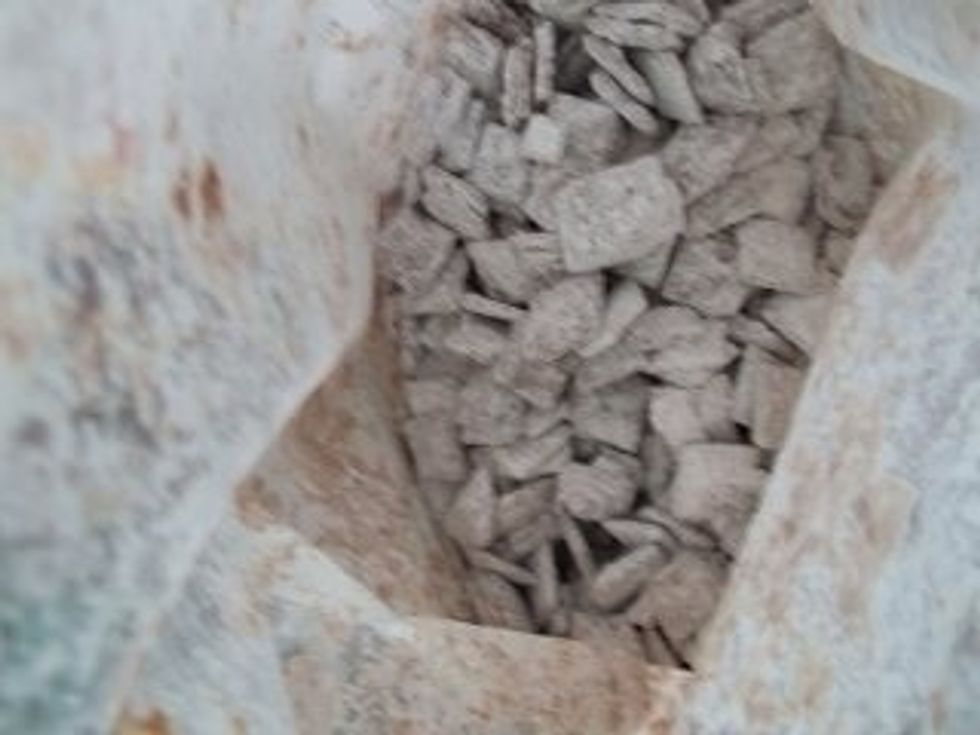 Place chex mix into bag close tight and begin to mix all the powdered sugar onto the chex mix. Now this is optional but place in freezer for about 15 minutes to cool and then serve :)!!!