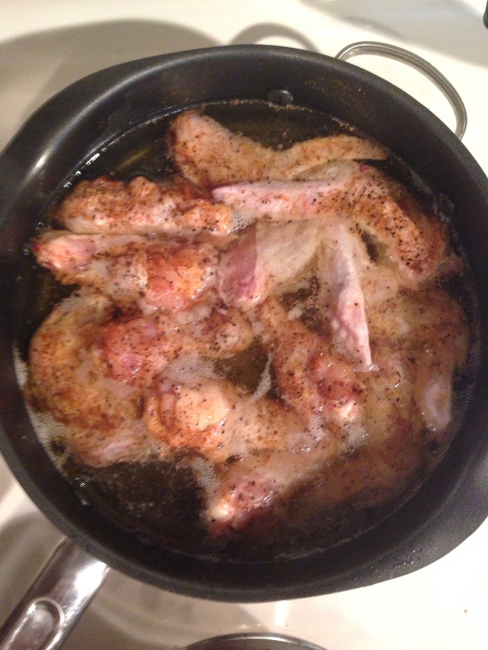 Place chicken in heated grease