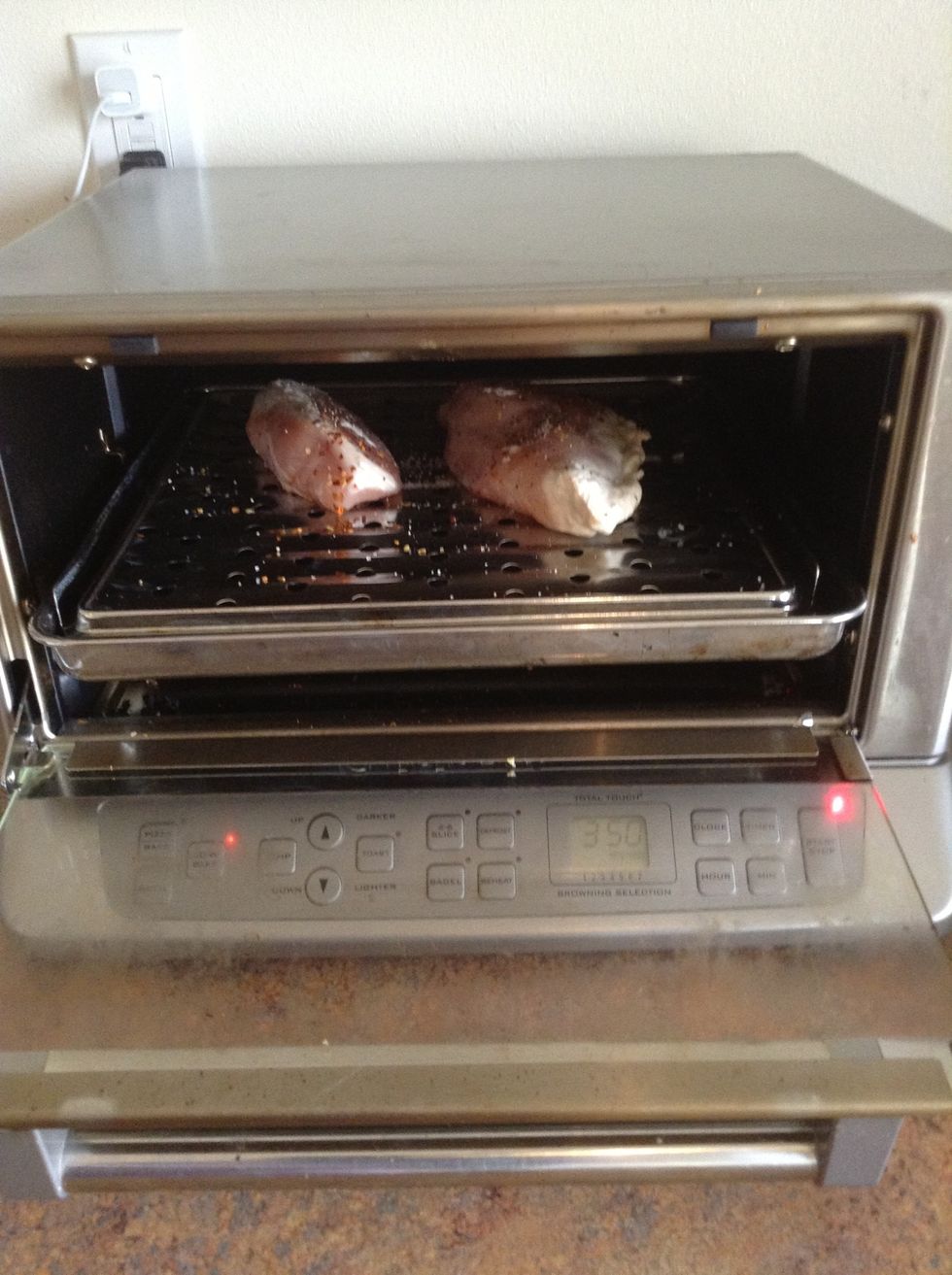 Place chicken in oven and cook until cooked all the way through (about 20 minutes)