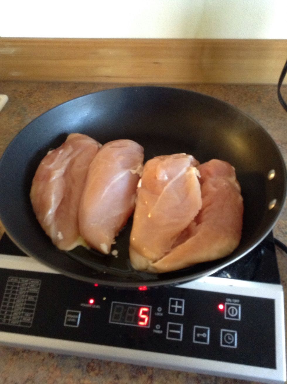 Place chicken in skillet.