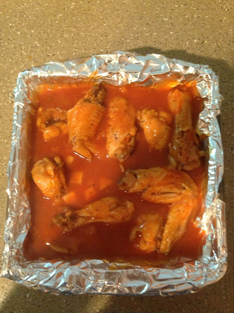 Place chicken n sauce in baking pan