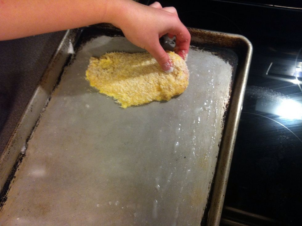 Place chicken on oiled cookie sheet