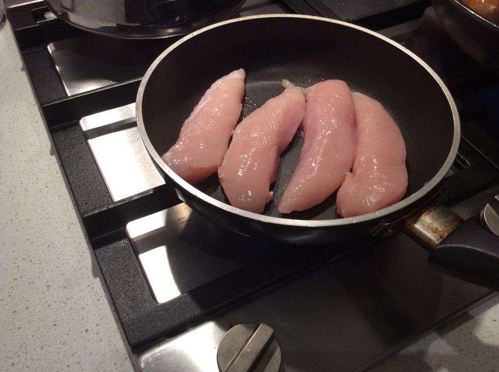 Place chicken tenderloins in the frying pan and cook until white all the way through