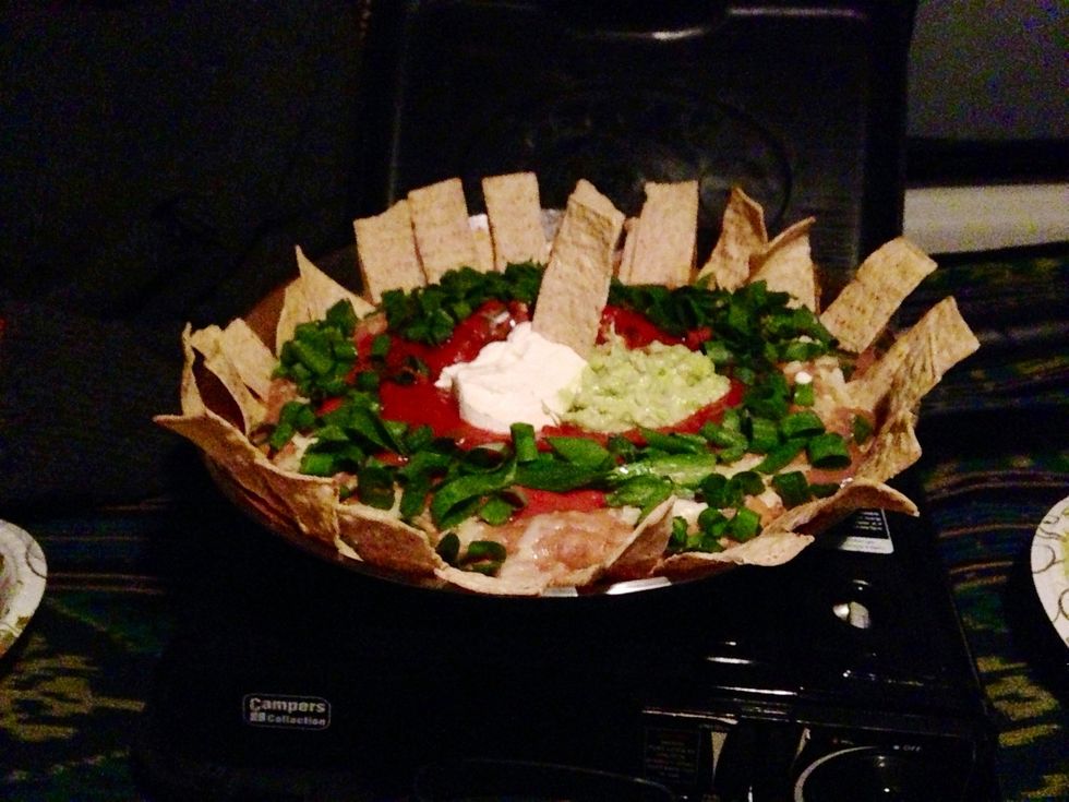 Place chips around the edge of the pan and you have camp friendly 'Pan-nachos'! So delish, So easy! And who doesn't love Mexican? Another bonus was that while it was cooking it was warming up our van!