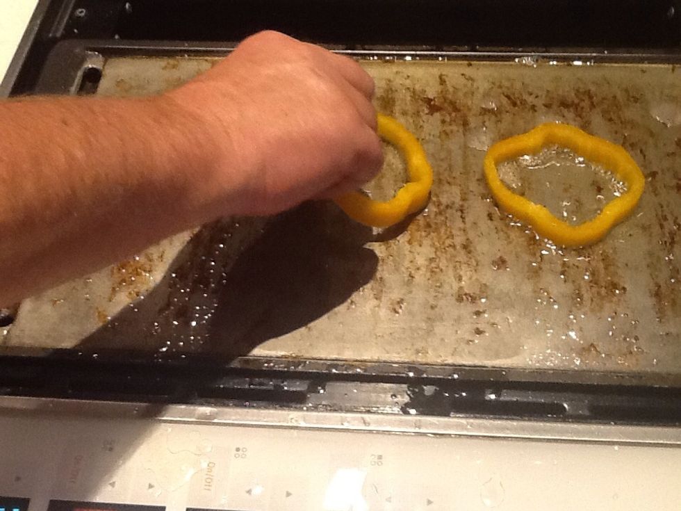Place circle sliced bell pepper on griddle.