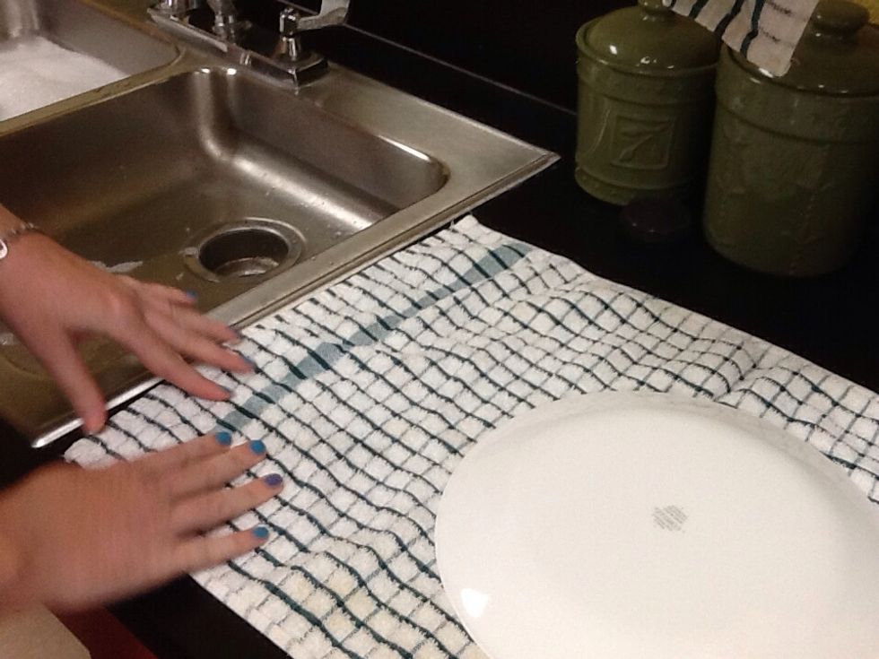 Place clean dish on drip cloth and proceed with remaining dirty dishes.