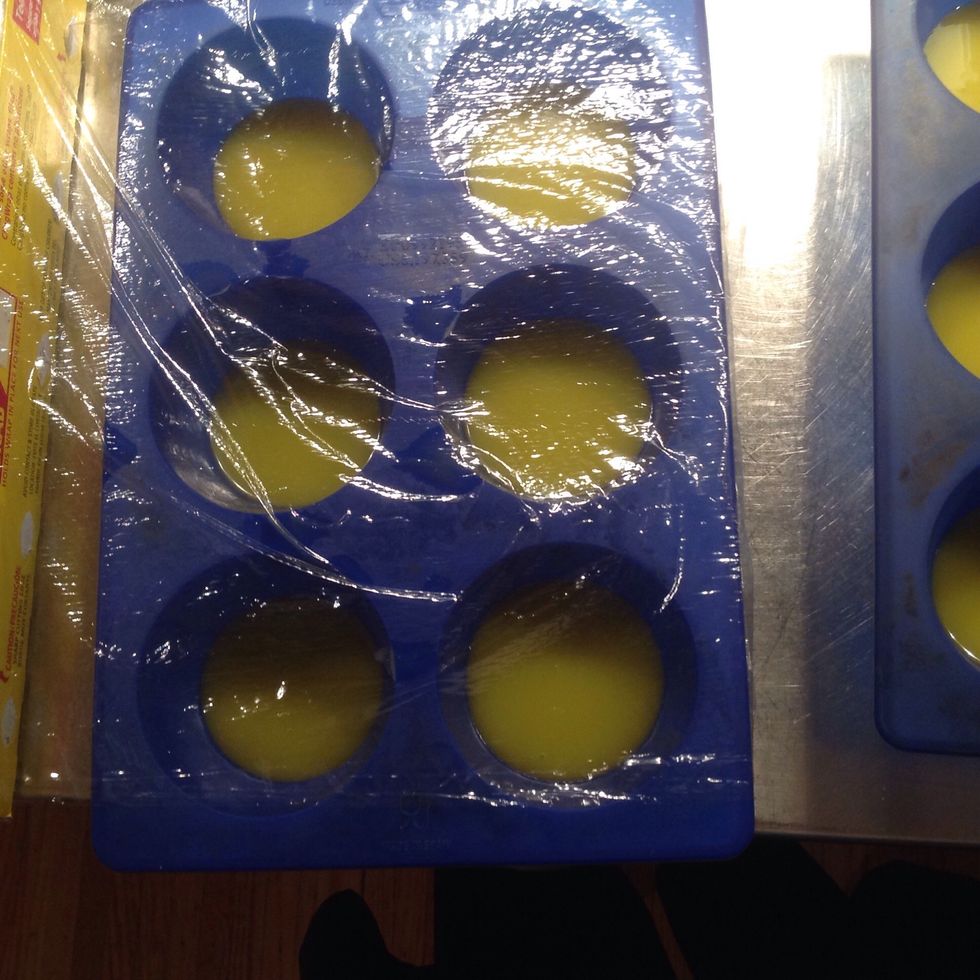 Place cling wrap over both molds.
