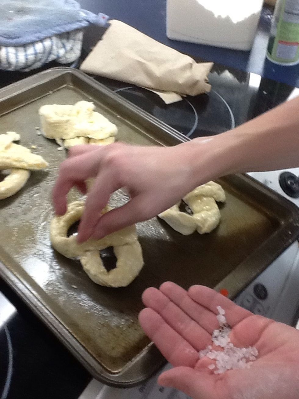 Place coarse salt on pretzels