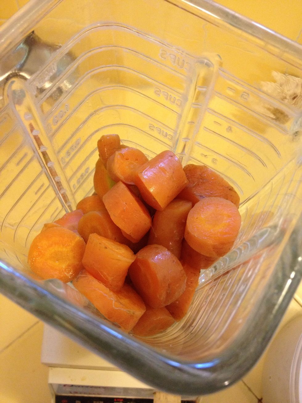 Place cooked carrots in a blender, Vitamix or food processor.