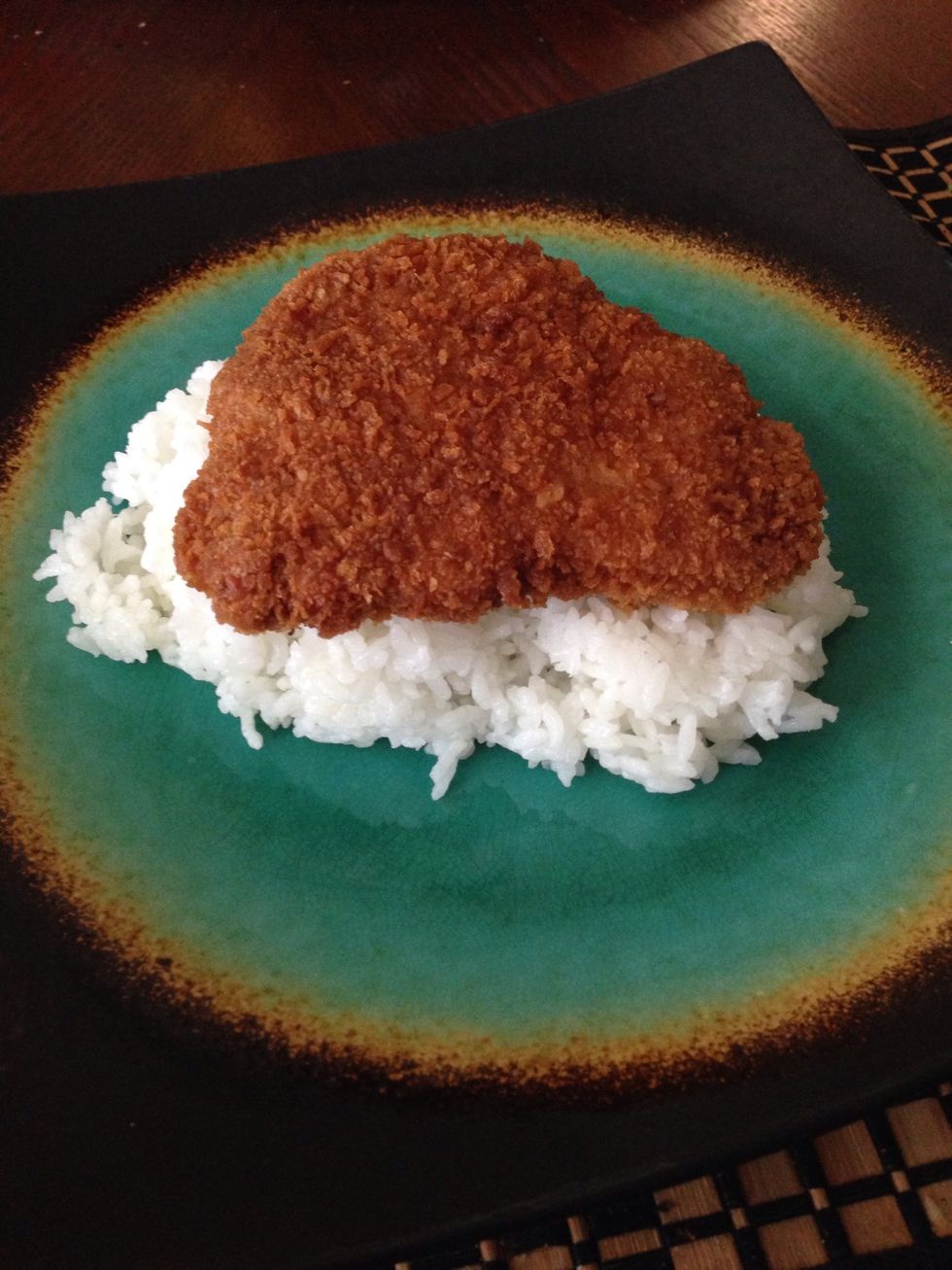Place cooked cutlet on sticky white rice (medium grain)