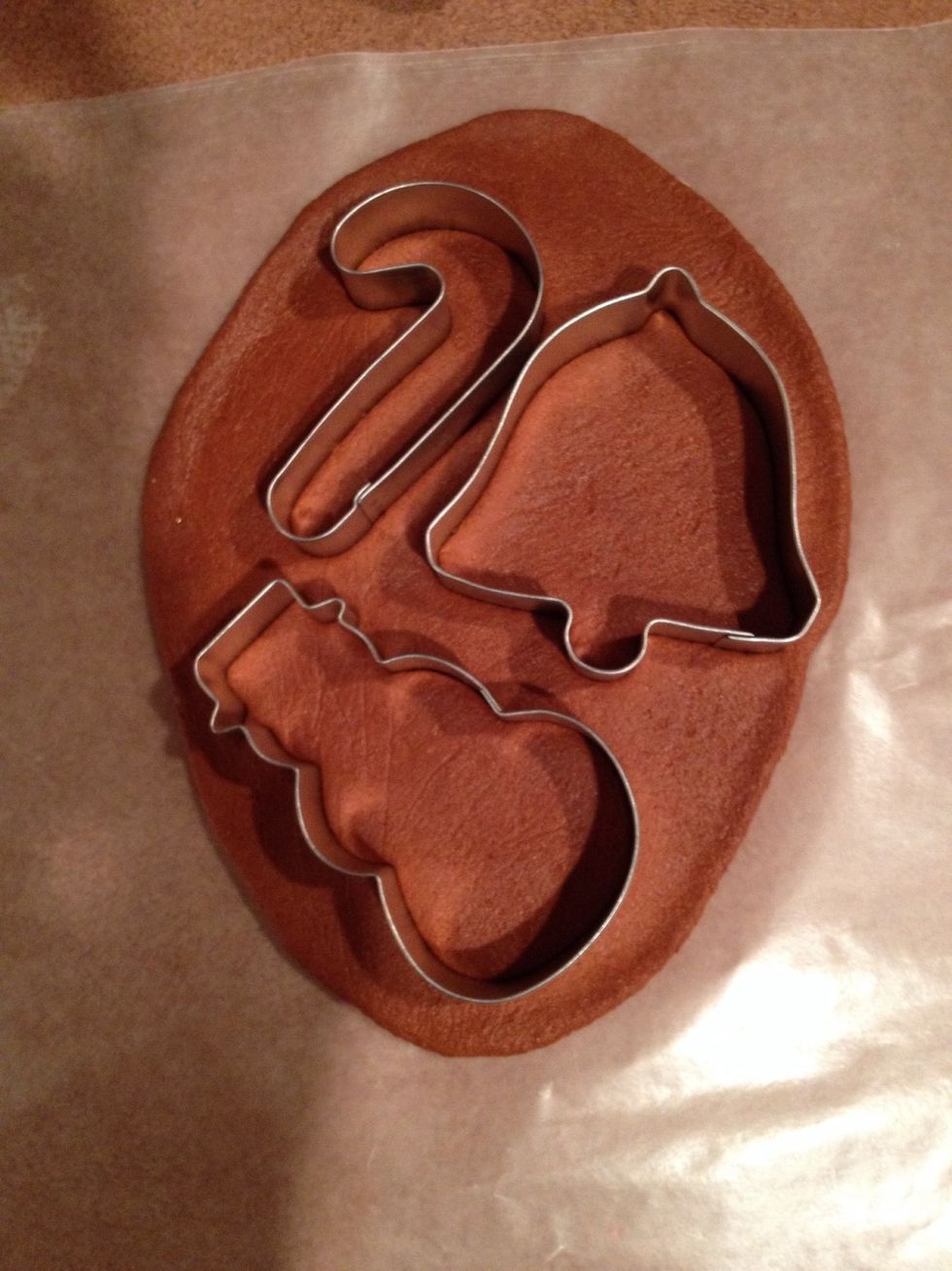 Place cookie cutters on dough and press down to cut out shapes.
