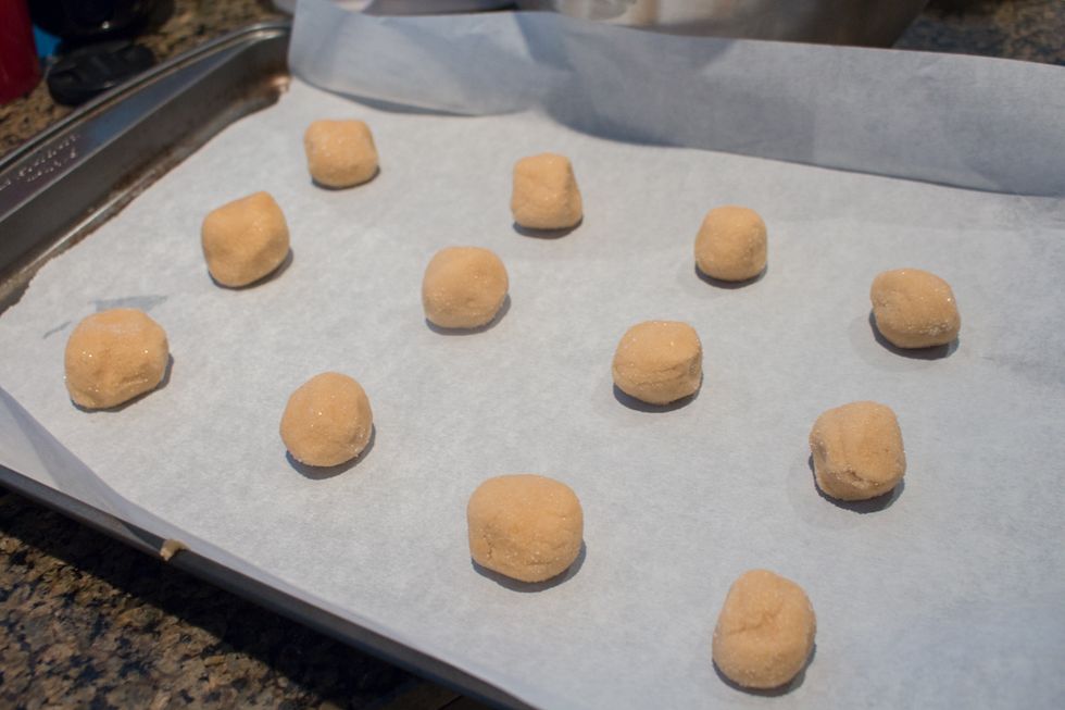 Place cookie dough balls on non-greased cookie sheet (here I have it on parchment paper).