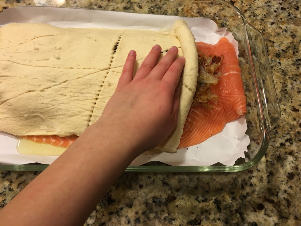 Place crescent roll on salmon fillet.