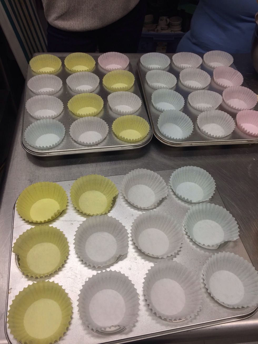Place cupcake liners in pans