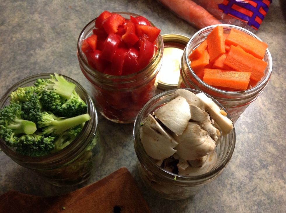 Place cut up veg into mason jars.