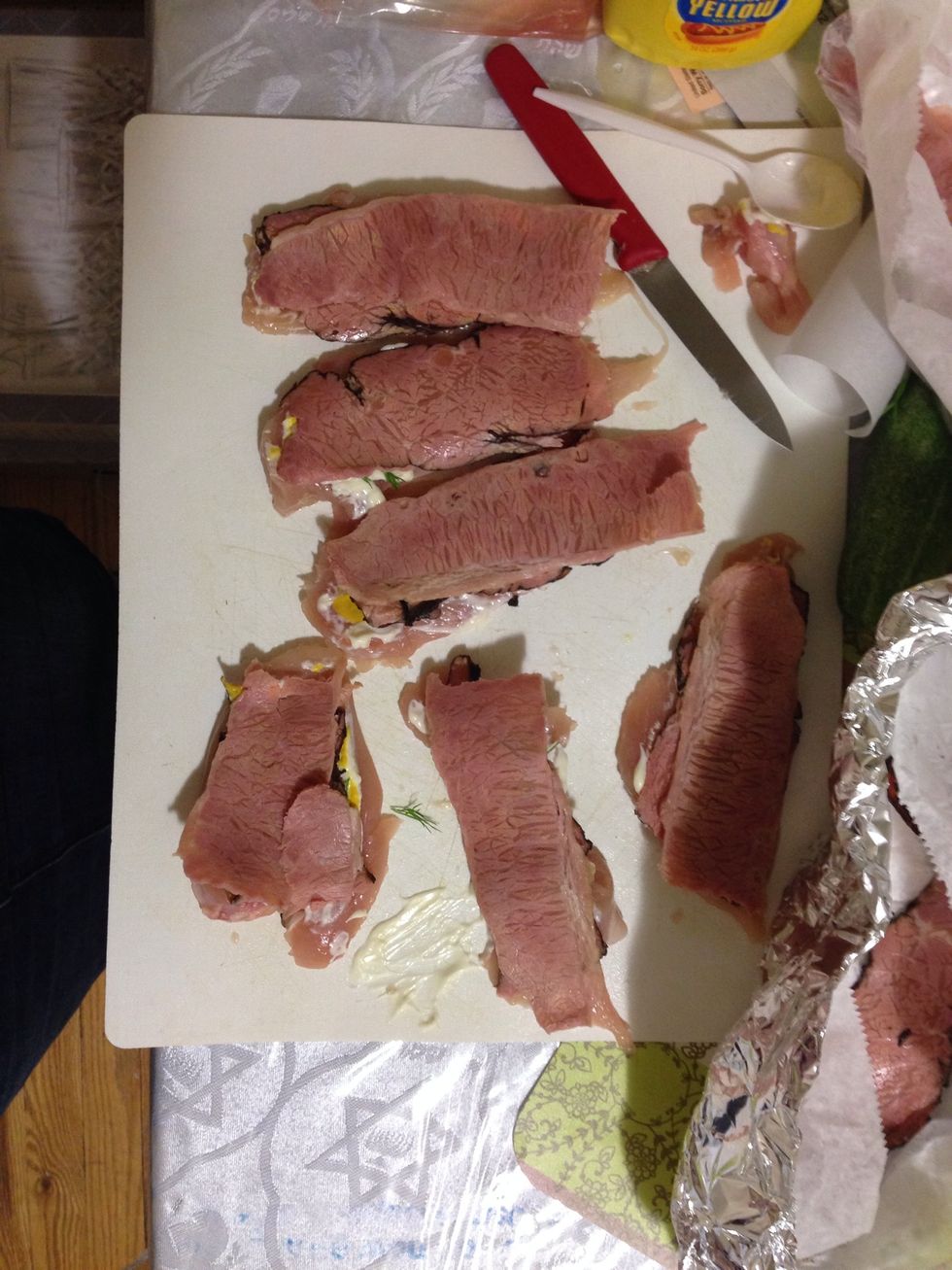Place deli meat on top that you have a bit of room on each long end for rolling