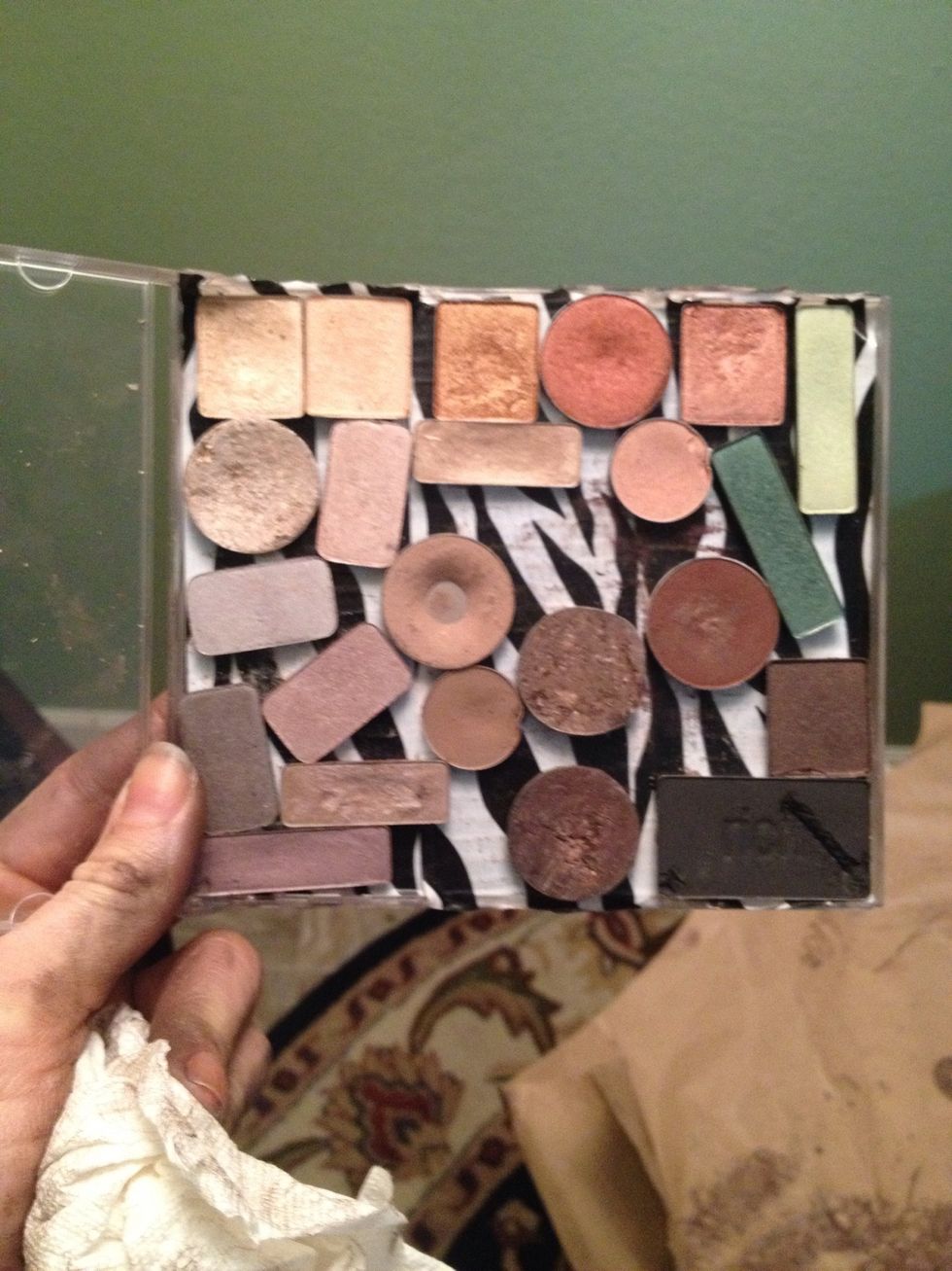 Place depotted eyeshadow tins on covered bottom and enjoy! If you find some of your tins aren't magnetized, as I did, simply cut leftover magnet sheet in little pieces and stick to the back of tins.