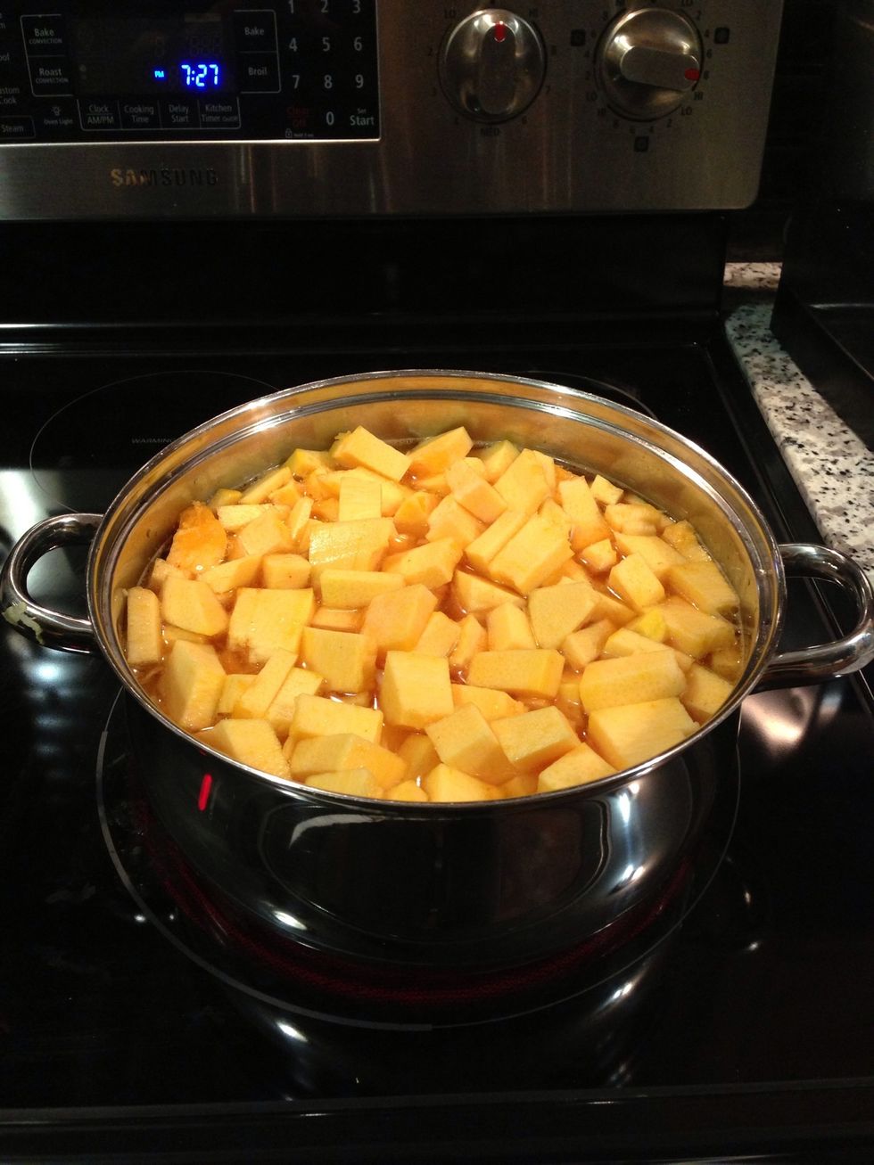 Place diced pumpkin in the pot with ginger, garlic and onions once they are translucent and add enough water to cover the pumpkin. Brin to a boil than simmer until pumpkin is soft(25-30min)