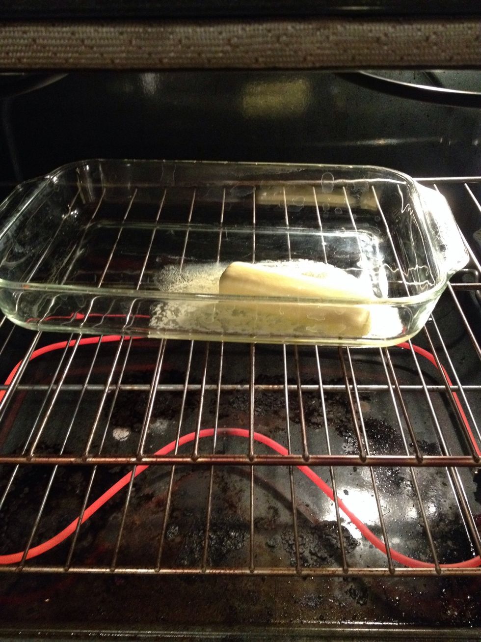 Place dish in oven to melt butter.