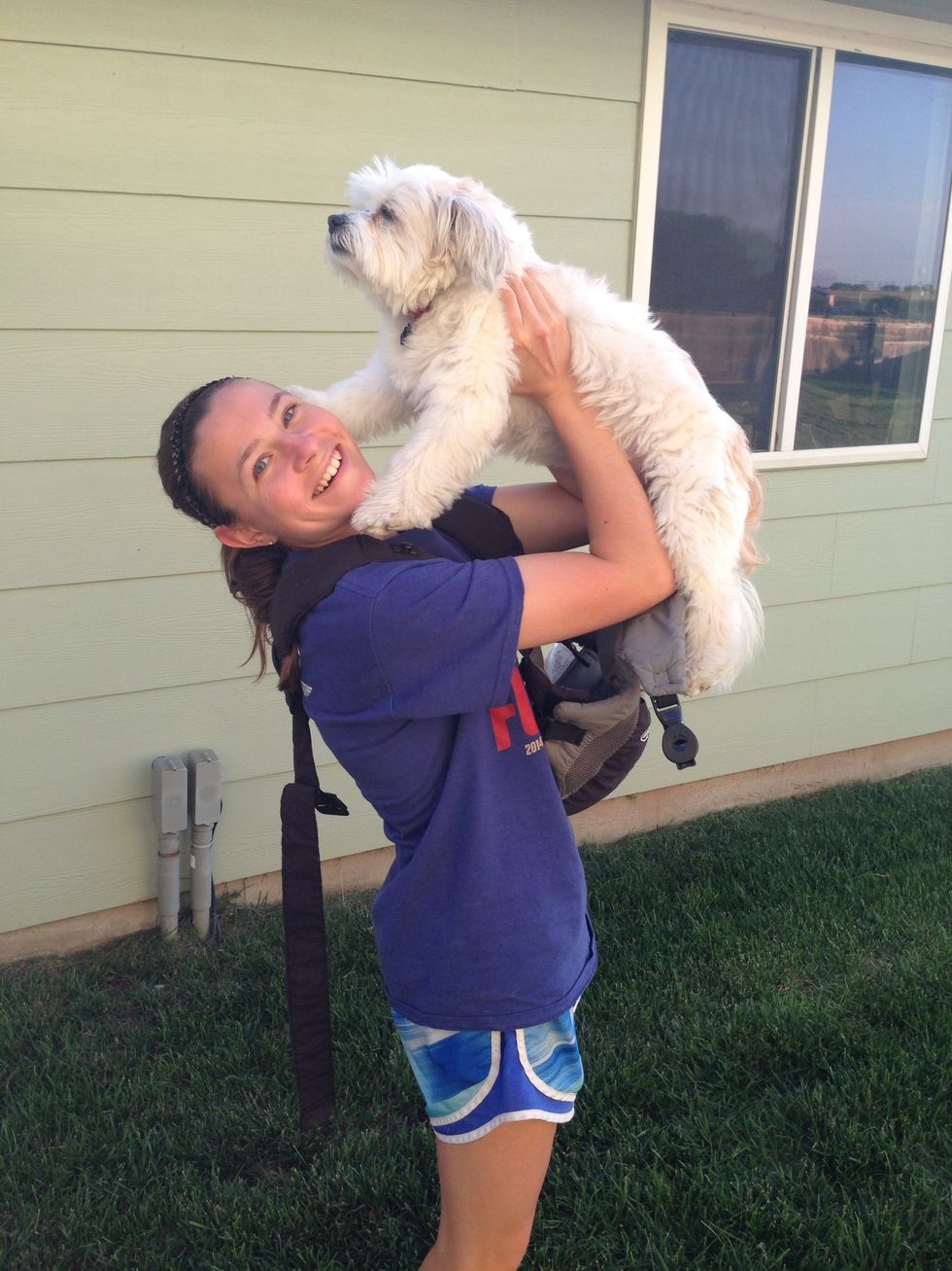 Place dog, facing you, into front pack.