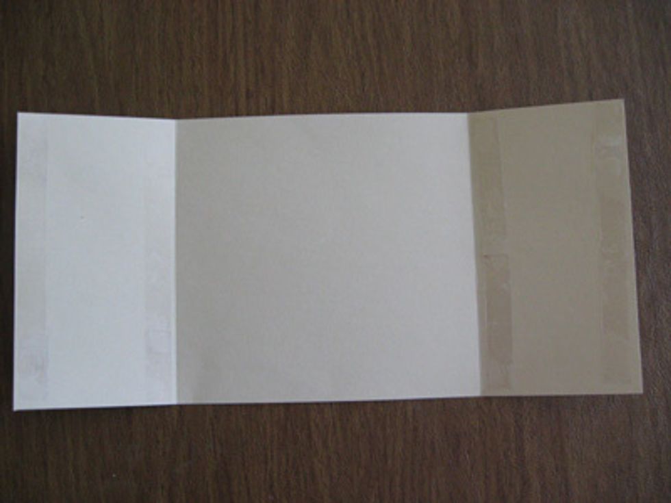 Place double sided tape on both of the 3 inch ends of one of the 5-3/4 inch and 12 inch pieces of cardstock.