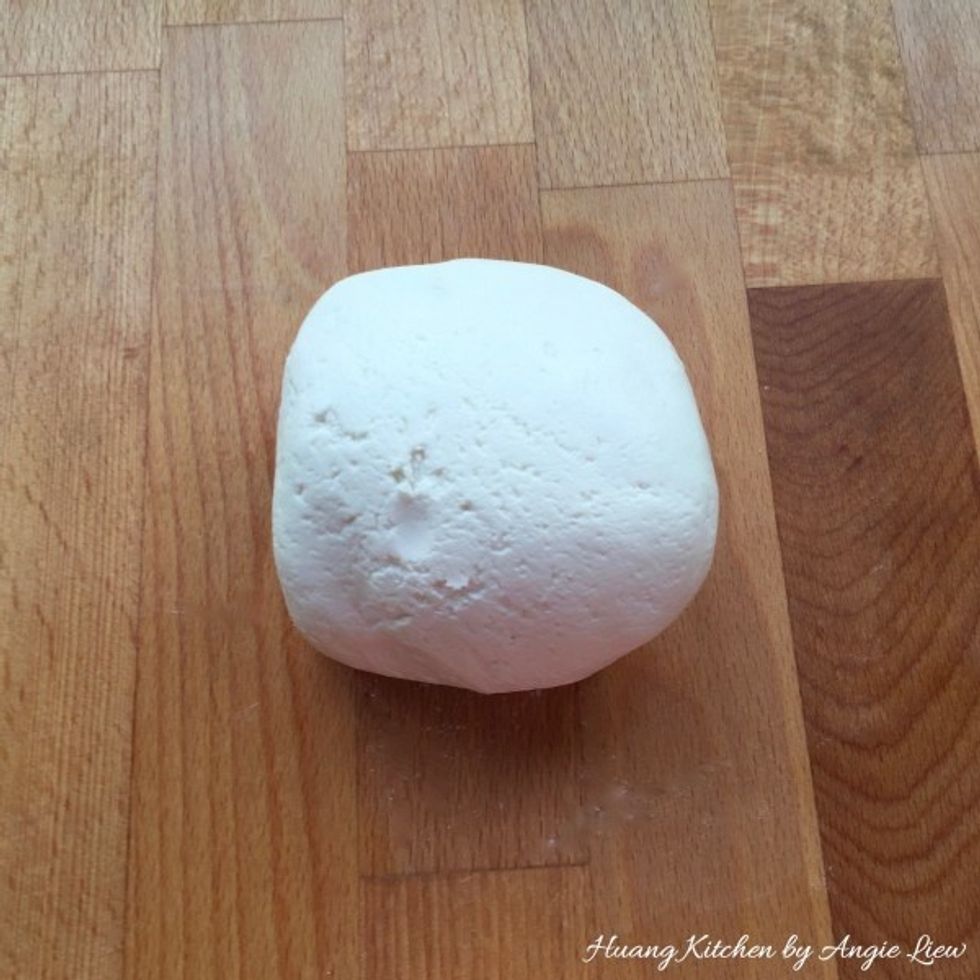Place dough on a work surface and knead well for about 10 minutes.