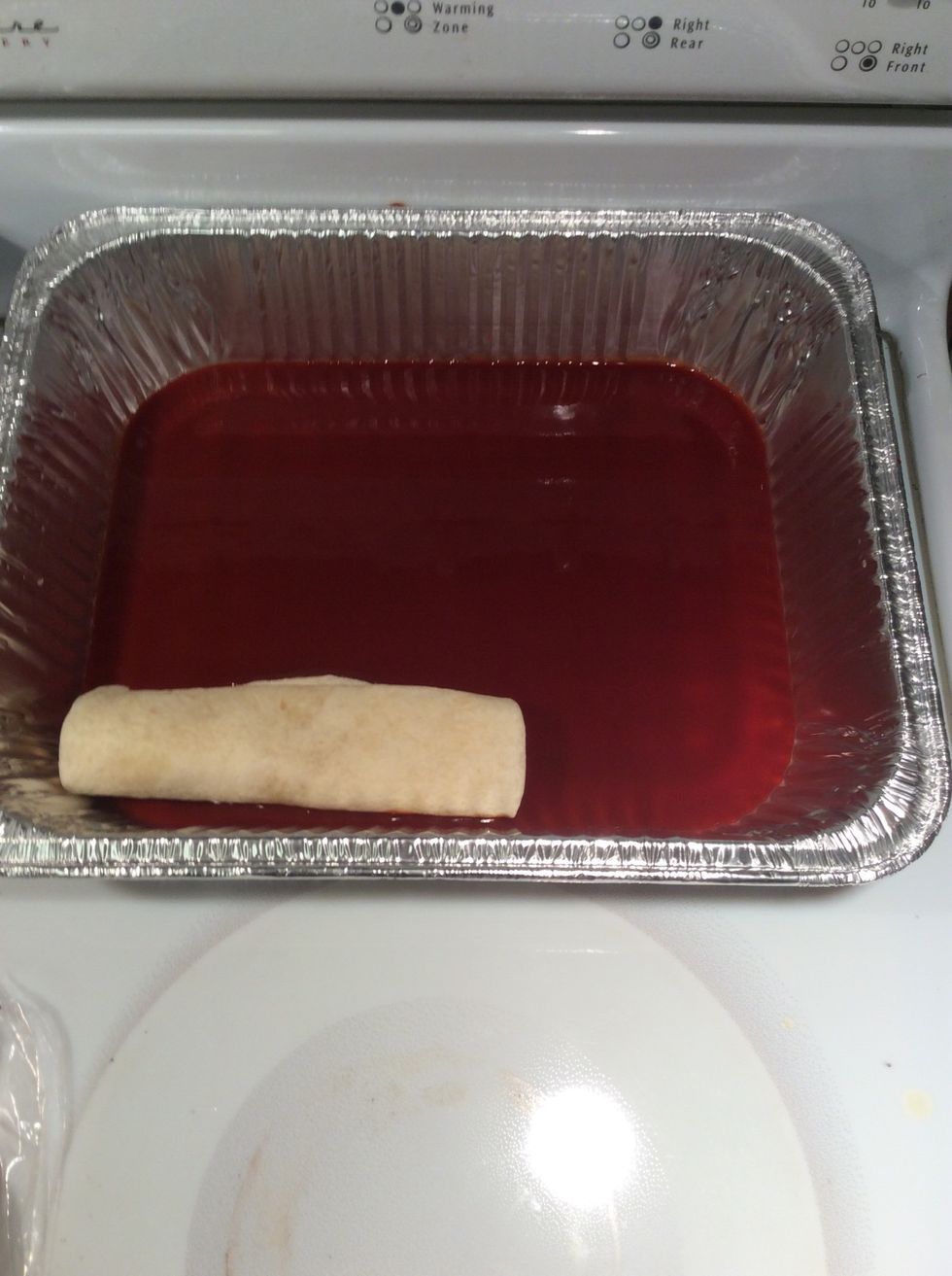 Place each one into the pan of red sauce. \u27a1\ufe0f