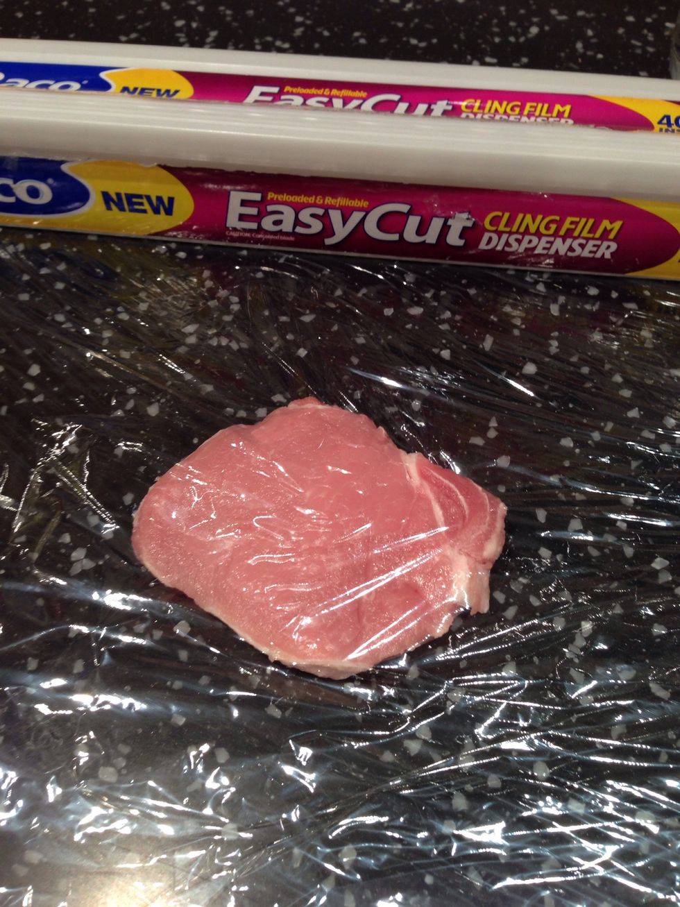 Place each pork loin between 2 lengths of cling film
