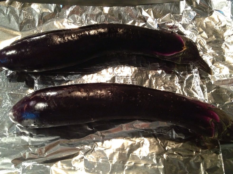 Place eggplants over foil on baking sheet and bake for 30 mins in a preheated oven at 375 degrees.