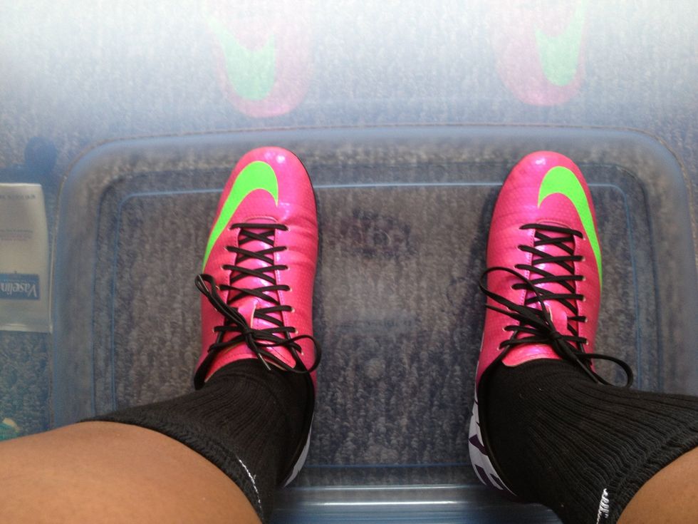 Place feet in the tub of water. (I didn't actually put water in the tub right now because I hate doing this.) use your hands to massage the sides of your feet squeezing the air out.