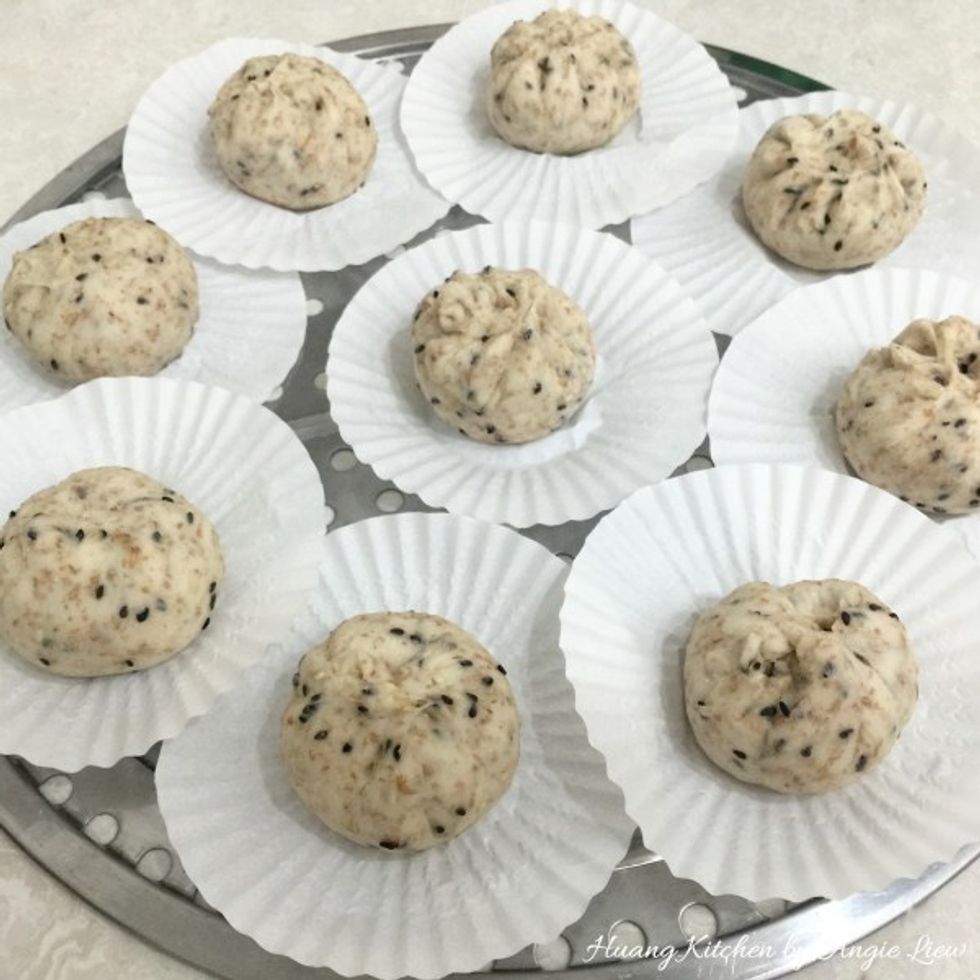 Place finished buns on parchment papers or cupcake liners.
