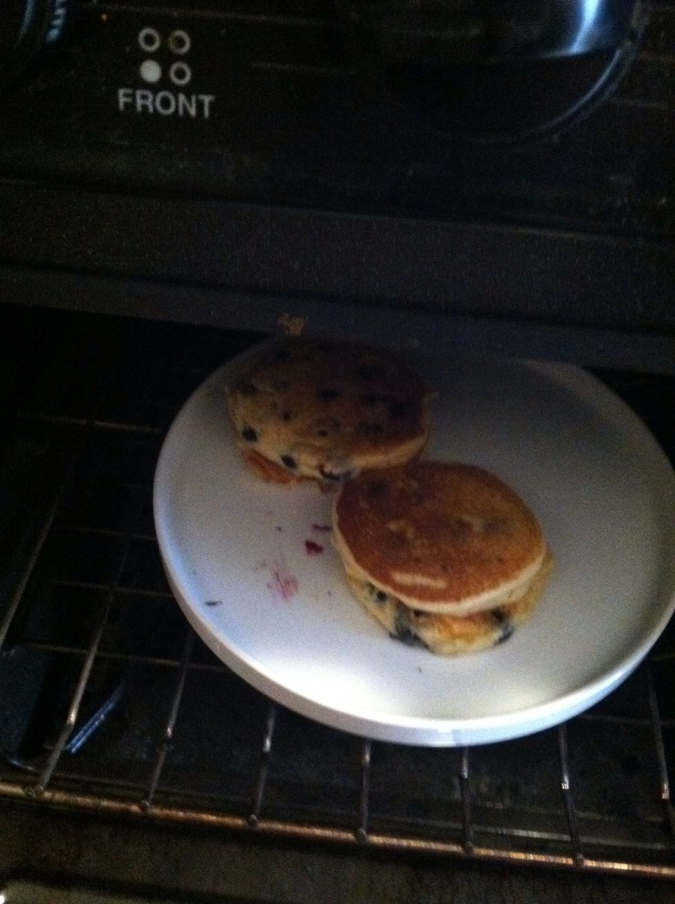 Place finished pancakes on a heat-safe dish in the oven to keep warm.