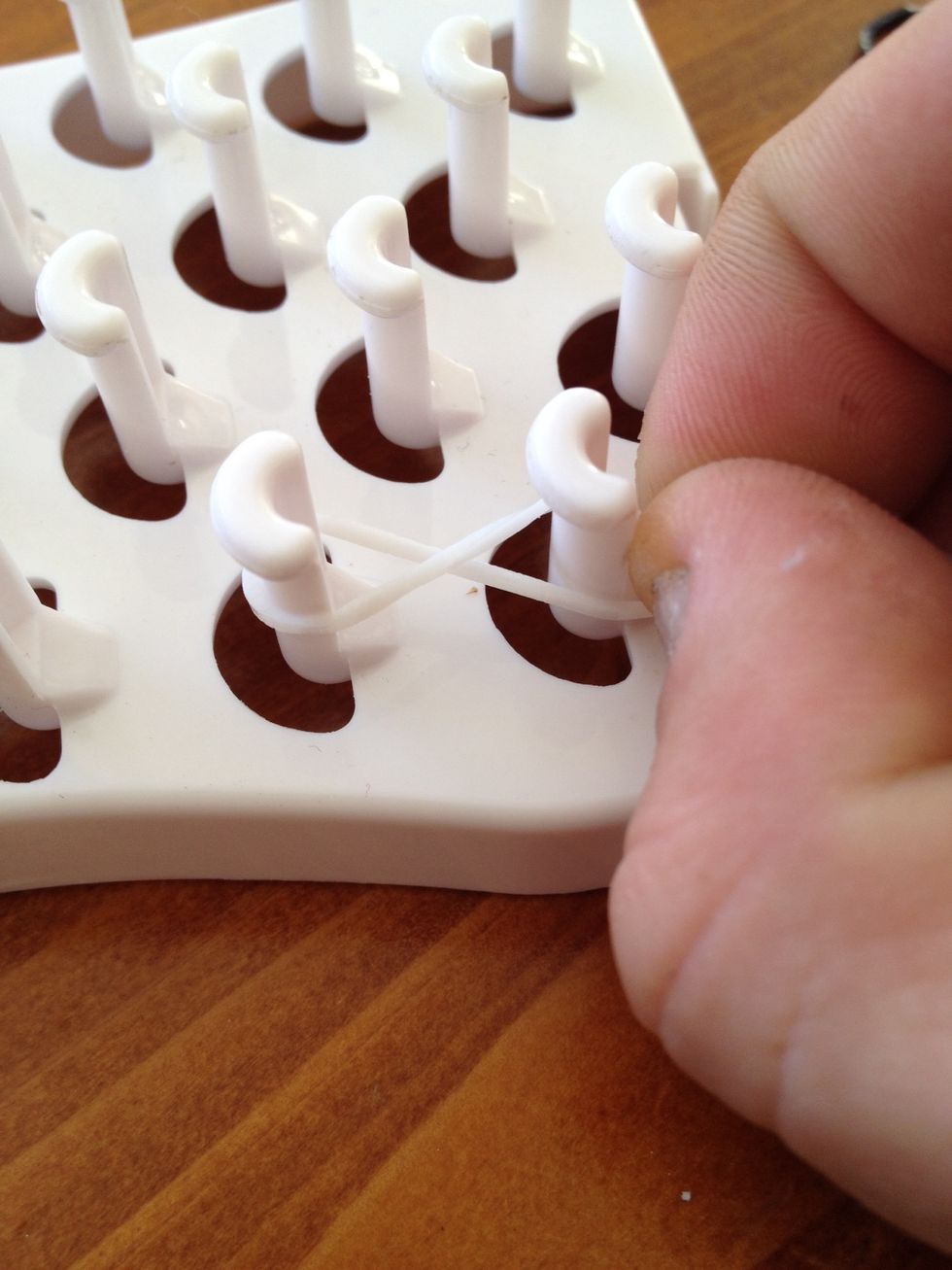 Place first band on your pins making sure it is in the shape of a figure 8