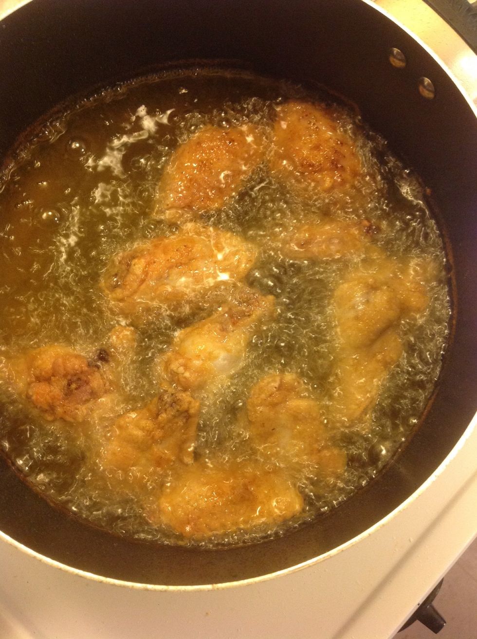 Place first batch in pan. (Test the oil to see if it's ready by sprinkling wonder or floor into it, if it begins to fizzle the oil is ready)