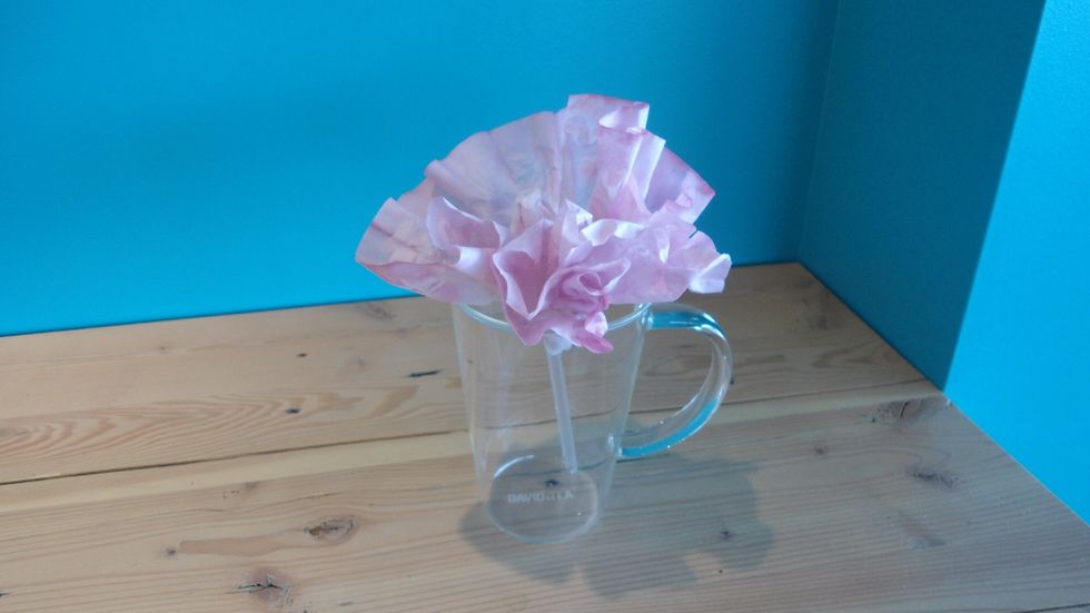 Place flowers in a glass mug...
