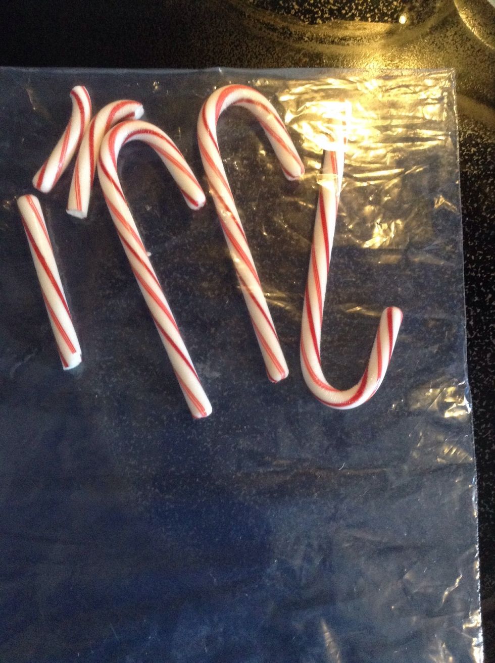 Place four candy canes into a plastic bag. Crush into bits by rolling over them with a rolling pin. Make sure there are no big chunks of candy.