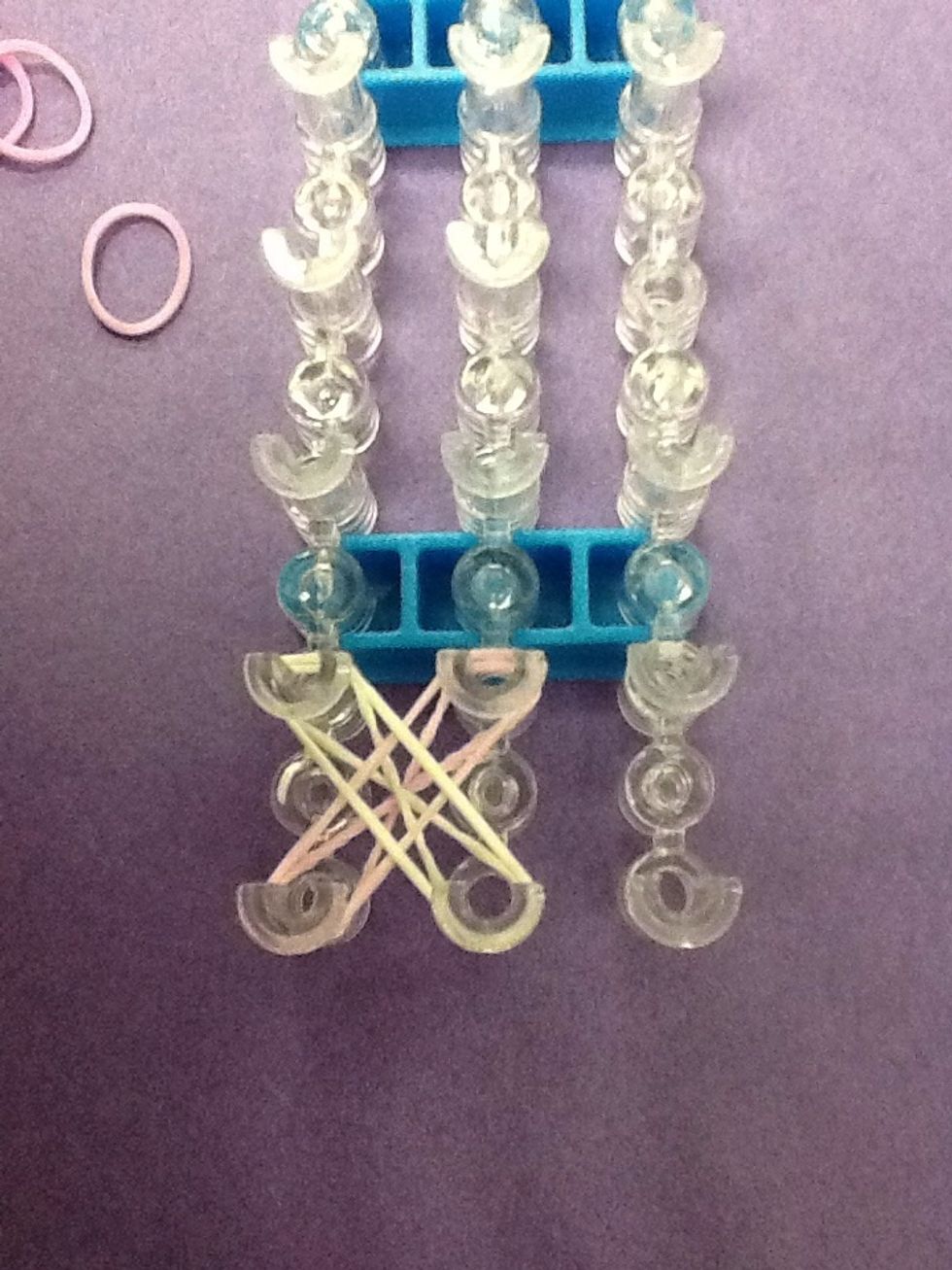 Place fourth band on the loom.